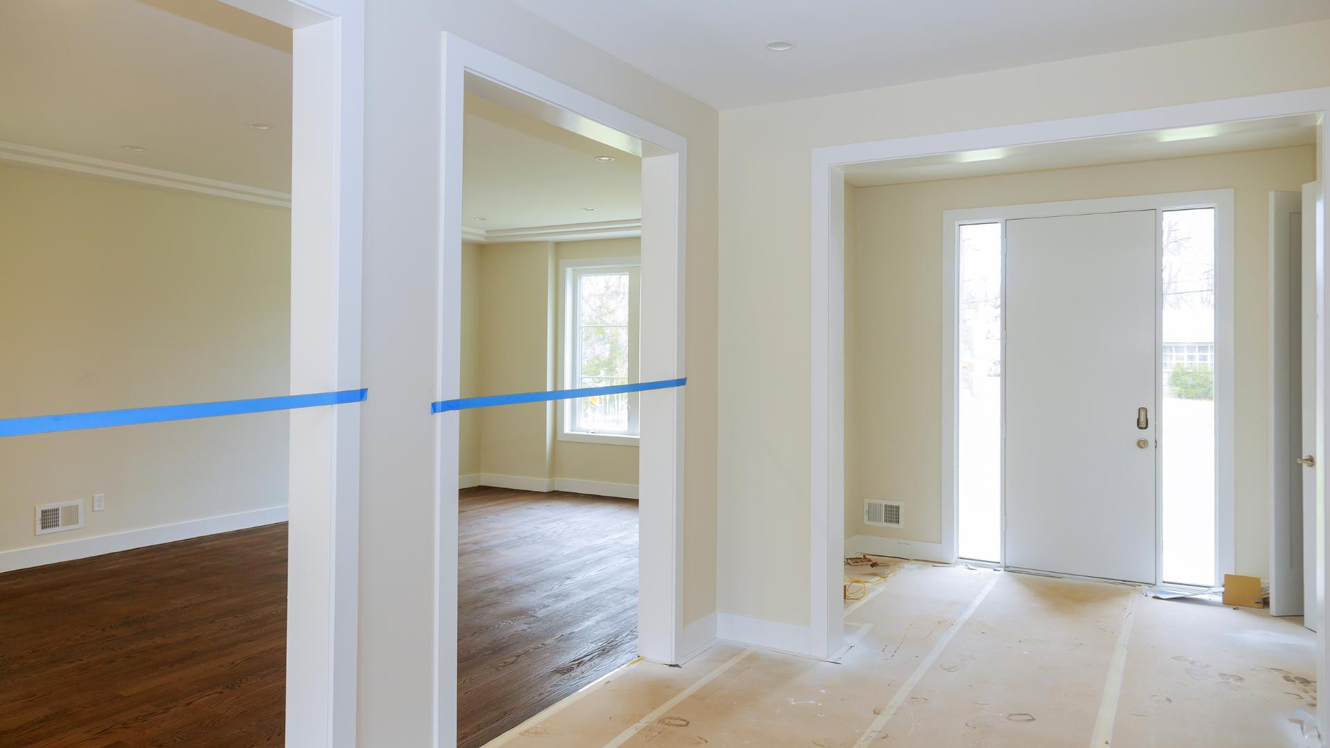 An empty room with a blue tape on the floor